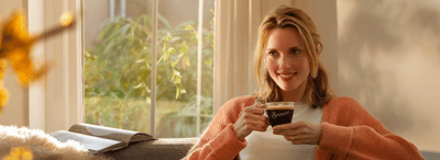 senseo about us woman drinking coffee